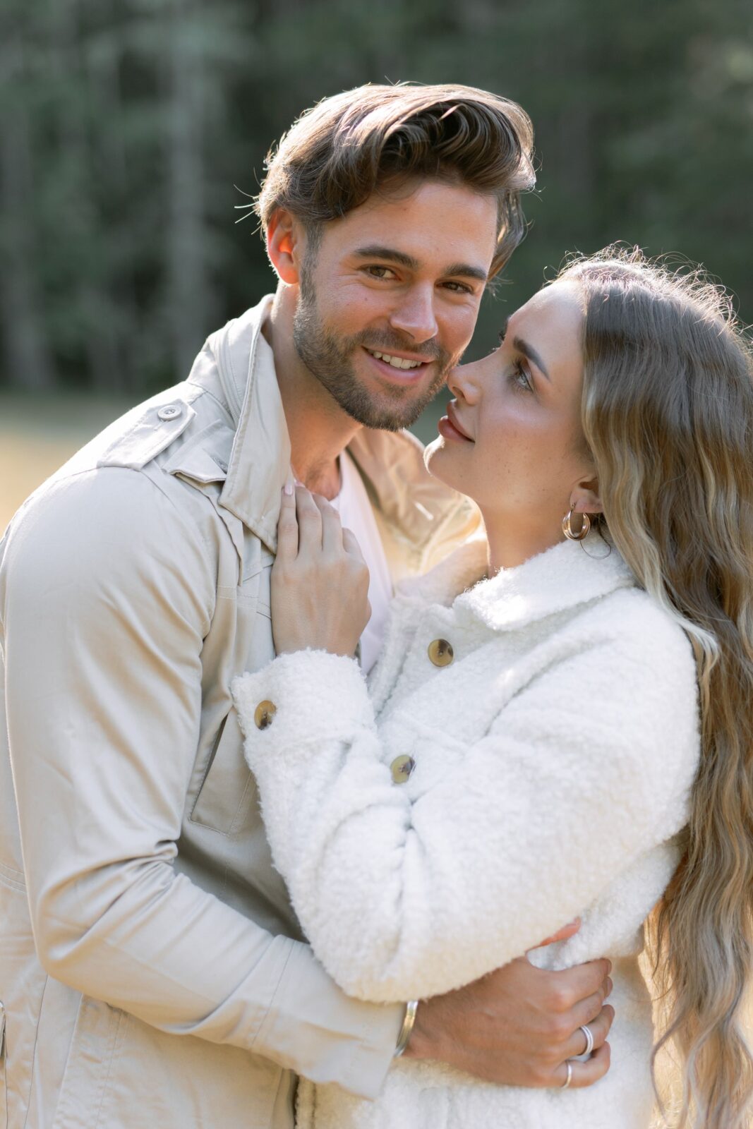 Groom to be smiles at the camera during his engagement session