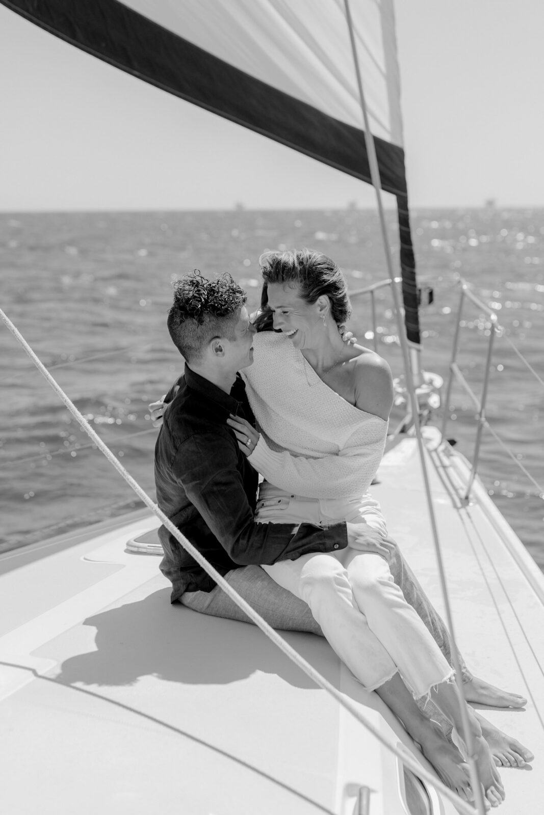 Black and white sailboat engagement photo