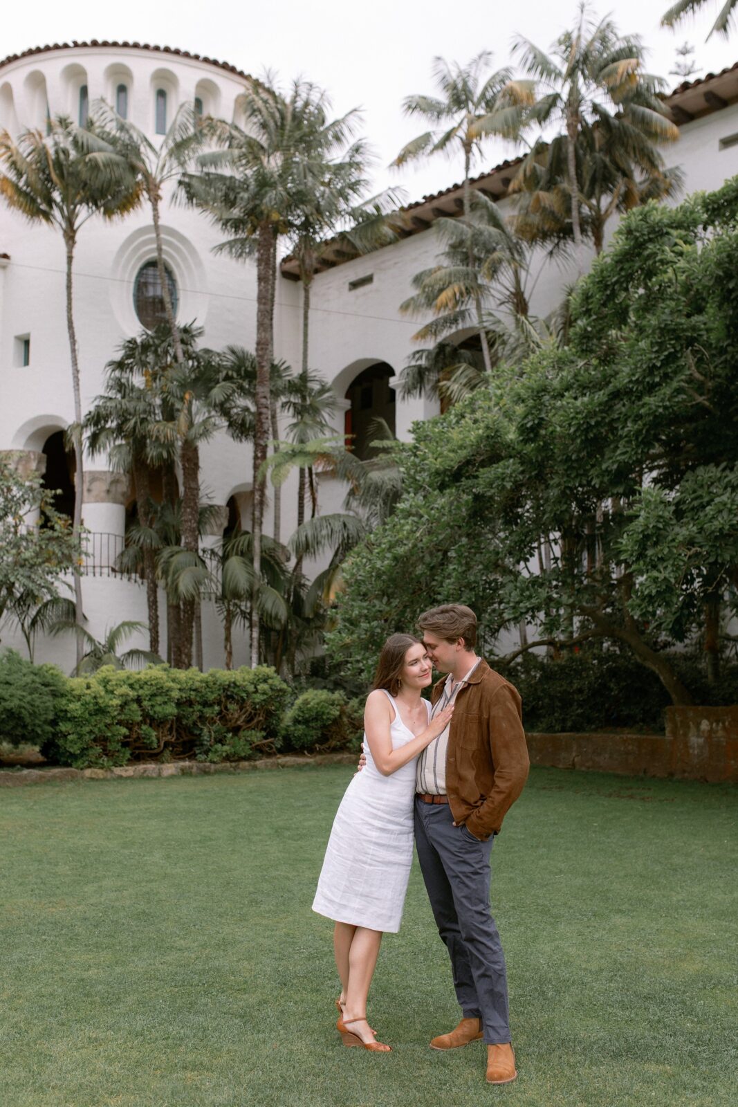 Bride and groom to be taking Santa Barbara Courthouse engagement photos